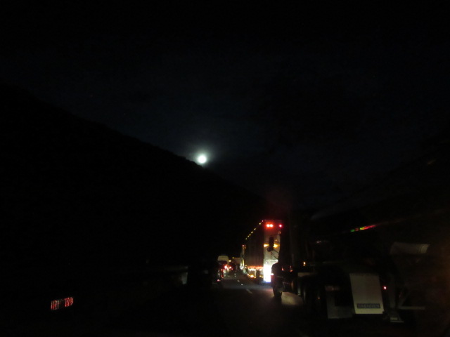 062618 Moon rising in the gorge over stopped traffic on I-40.JPG
