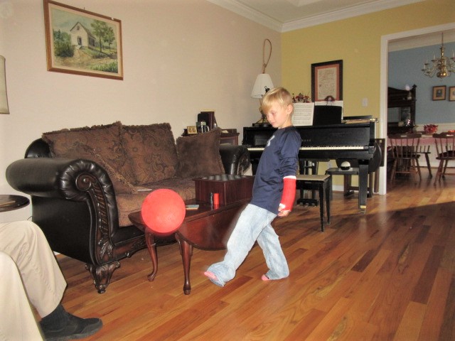 110618 Logan plays balloon with his feet.JPG